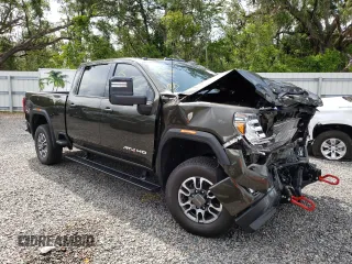 2023 GMC Sierra 3500HD AT4 z VIN 1GT49VEY3PF127108, wystawiony jako Copart lot #57052823 z przebiegiem 9915 mil mil oraz Szkody całkowita. Historia ofert i sprzedaży dostępna na DreamBid. Obrazek 4.
