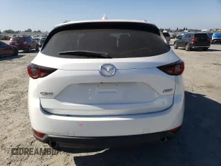 2018 Mazda CX-5 Touring z VIN JM3KFACM7J0370737, wystawiony jako Copart lot #60113725 z przebiegiem 131 385 mil mil oraz Szkoda całkowita • Salvage title. Historia ofert i sprzedaży dostępna na DreamBid. Obrazek 6.