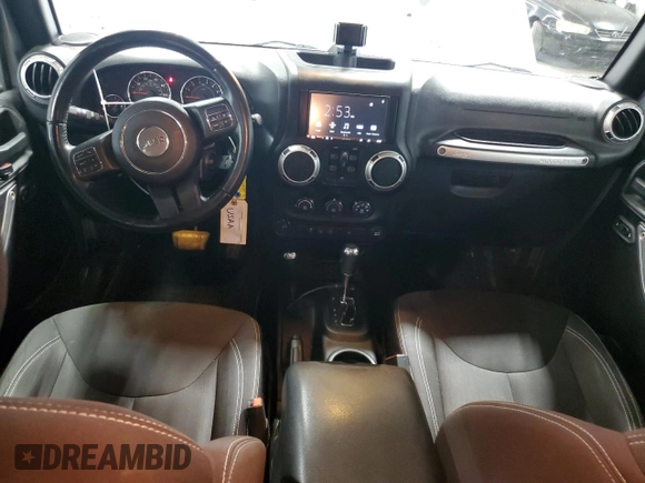 2015 Jeep Wrangler Unlimited Sahara with VIN 1C4BJWEG5FL743663, listed as a Copart auction lot 60205225 with 69,922 mi miles and Salvage title. Bid and sale history available at DreamBid. Image 8.