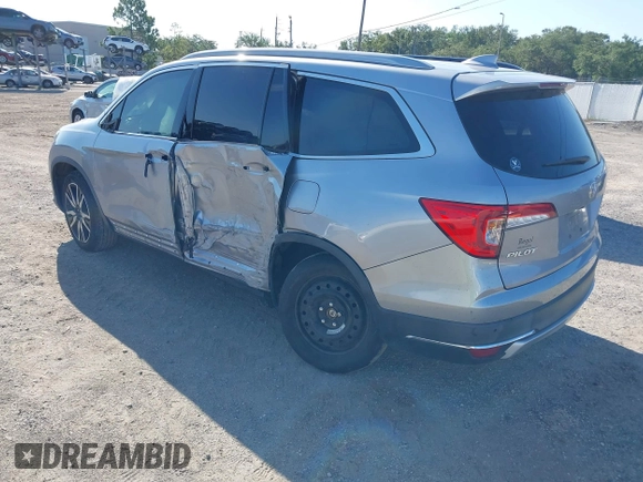 2019 Honda Pilot Elite with VIN 5FNYF6H00KB001016, listed as a IAAI auction lot 42583325 with 133,327 mi miles and . Bid and sale history available at DreamBid. Image 3.