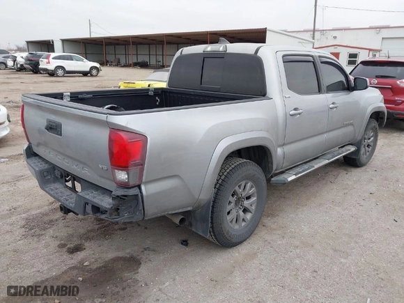 2018 Toyota Tacoma SR5 with VIN 3TMAZ5CN7JM053453, listed as a IAAI auction lot 41430111 with 128,149 mi miles. Bid and sale history available at carsss.com. Image 4.