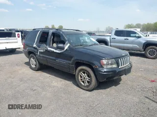 2004 Jeep Grand Cherokee Laredo with VIN 1J4GW48S94C334648, listed as a IAAI auction lot 41909829 with 155,411 mi miles. Bid and sale history available at carsss.com. Image 1.