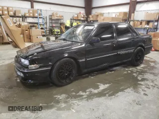 1988 Mitsubishi Galant with VIN E39A0010917, listed as a Copart auction lot 44421775 with 14,813 mi miles and Salvage Title. Bid and sale history available at DreamBid. Image 1.