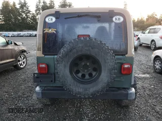 2000 Jeep Wrangler Sport with VIN 1J4FA49S1YP748529, listed as a Copart auction lot 77041924 with 154,949 mi miles and Salvage Title. Bid and sale history available at carsss.com. Image 6.