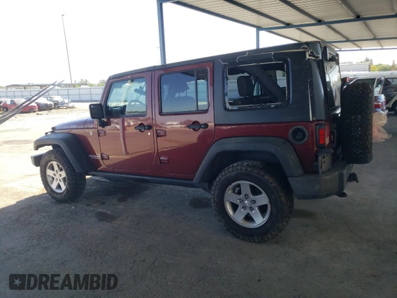 2010 Jeep Wrangler Unlimited Rubicon with VIN 1J4BA6H18AL197855, listed as a Copart auction lot 57748185 with 147,899 mi miles and Salvage title. Bid and sale history available at DreamBid. Image 2.