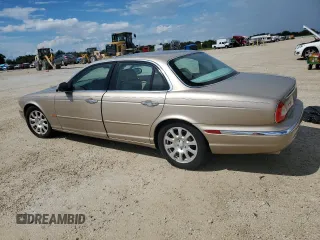 2004 Jaguar XJ with VIN SAJWA71C24SG28164, listed as a Copart auction lot 73968134 with 0 mi miles and Salvage Title. Bid and sale history available at carsss.com. Image 2.