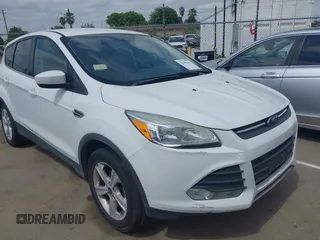 2015 Ford Escape SE z VIN 1FMCU0G70FUA44162, wystawiony jako IAAI lot #42045363 z przebiegiem 127 868 mil mil oraz . Historia ofert i sprzedaży dostępna na DreamBid. Obrazek 1.