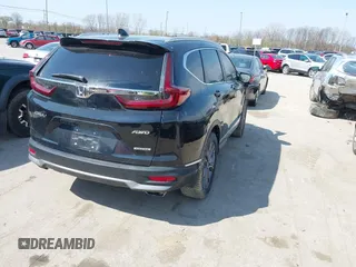 2021 Honda CR-V Touring with VIN 5J6RW2H94ML013546, listed as a IAAI auction lot 42058560 with 22,454 mi miles. Bid and sale history available at carsss.com. Image 4.