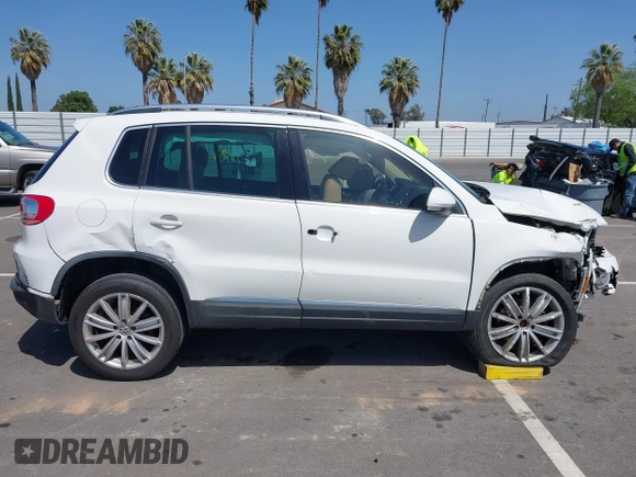 2014 Volkswagen Tiguan SEL with VIN WVGAV3AX9EW512956, listed as a IAAI auction lot 42110002 with 136,034 mi miles and . Bid and sale history available at DreamBid. Image 13.