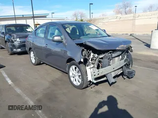 2014 Nissan Versa S with VIN 3N1CN7APXEL817010, listed as a IAAI auction lot 41460129 with 137,040 mi miles. Bid and sale history available at carsss.com. Image 1.