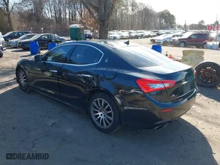 2014 Maserati Ghibli S Q4 with VIN ZAM57RTA1E1091738, listed as a IAAI auction lot 41518359 with 75,641 mi miles. Bid and sale history available at carsss.com. Image 3.