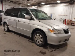 2004 Honda Odyssey EX-L with VIN 5FNRL18974B127696, listed as a IAAI auction lot 41643243 with 200,286 mi miles and . Bid and sale history available at DreamBid. Image 1.