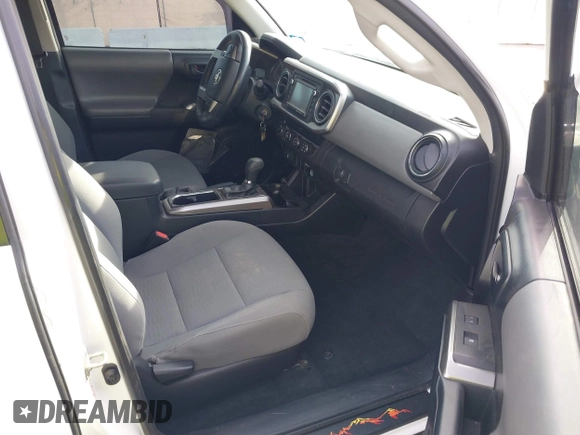 2019 Toyota Tacoma SR z VIN 3TMCZ5AN6KM284101, wystawiony jako IAAI lot #41099466 z przebiegiem 36 119 mil mil oraz . Historia ofert i sprzedaży dostępna na DreamBid. Obrazek 5.