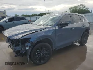 2023 Mazda CX-5 S Carbon Edition z VIN JM3KFBCMXP0287821, wystawiony jako Copart lot #54335935 z przebiegiem 21 277 mil mil oraz Szkody całkowita. Historia ofert i sprzedaży dostępna na DreamBid. Obrazek 1.