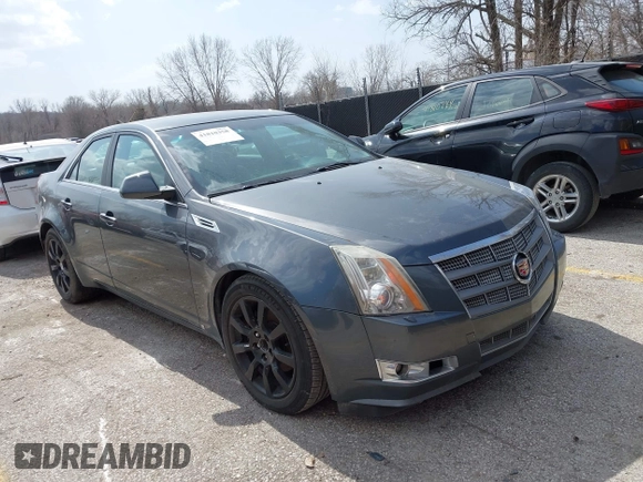 2009 Cadillac CTS RWD z VIN 1G6DF577790133127, wystawiony jako IAAI lot #41810358 z przebiegiem 220 278 mil mil oraz . Historia ofert i sprzedaży dostępna na DreamBid. Obrazek 1.