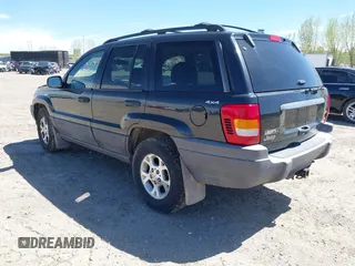 1999 Jeep Grand Cherokee Laredo with VIN 1J4GW58S8XC524502, listed as a IAAI auction lot 42193506 with 147,920 mi miles and . Bid and sale history available at DreamBid. Image 3.