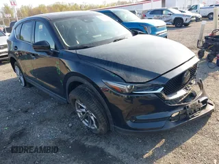 2019 Mazda CX-5 Grand Touring with VIN JM3KFBDM7K0525650, listed as a IAAI auction lot 42032757 with 65,530 mi miles and . Bid and sale history available at DreamBid. Image 1.
