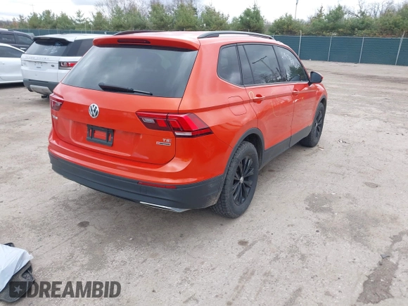 2018 Volkswagen Tiguan S with VIN 3VV0B7AX4JM124500, listed as a IAAI auction lot 41974671 with 76,970 mi miles and . Bid and sale history available at DreamBid. Image 4.