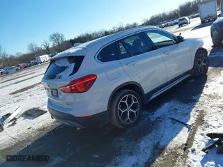 2018 BMW X1 xDrive28i with VIN WBXHT3C36J5L30217, listed as a IAAI auction lot 41237775 with 60,071 mi miles. Bid and sale history available at carsss.com. Image 4.