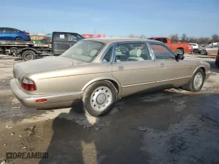 1999 Jaguar XJ with VIN SAJKX6040XC857312, listed as a Copart auction lot 84918704 with 75,425 mi miles and Clean Title. Bid and sale history available at carsss.com. Image 3.