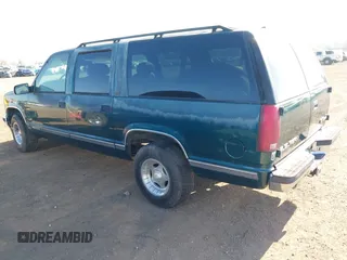 1996 GMC Suburban with VIN 1GDEC16R5TJ742543, listed as a IAAI auction lot 41910103 with 159,469 mi miles and . Bid and sale history available at DreamBid. Image 3.