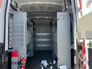 2023 Ford Transit Cargo with VIN 1FTBR1X80PKC02609, listed as a IAAI auction lot 42845487 with 6,879 mi miles and . Bid and sale history available at DreamBid. Image 1.
