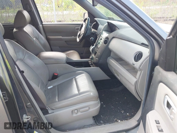 2011 Honda Pilot Touring with VIN 5FNYF4H90BB103824, listed as a IAAI auction lot 42127137 with 243,858 mi miles and . Bid and sale history available at carsss.com. Image 5.