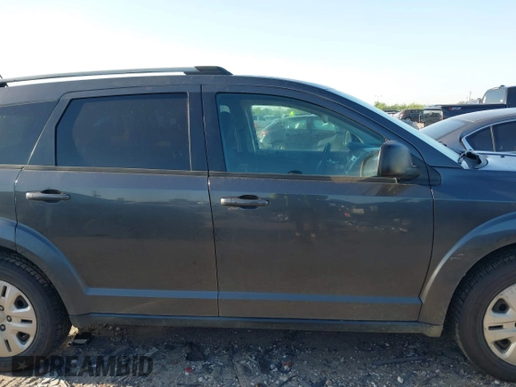2017 Dodge Journey SE z VIN 3C4PDCAB9HT551840, wystawiony jako IAAI lot #41977338 z przebiegiem 202 856 mil mil oraz . Historia ofert i sprzedaży dostępna na DreamBid. Obrazek 13.