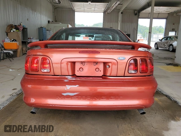 1997 Ford Mustang GT with VIN 1FALP42X3VF130827, listed as a Copart auction lot 60529995 with 112,799 mi miles and Salvage title. Bid and sale history available at DreamBid. Image 6.