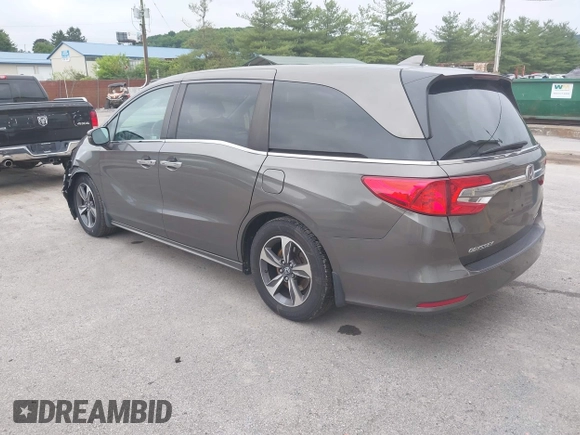 2018 Honda Odyssey Touring with VIN 5FNRL6H89JB057148, listed as a IAAI auction lot 42511909 with 166,438 mi miles and . Bid and sale history available at DreamBid. Image 3.