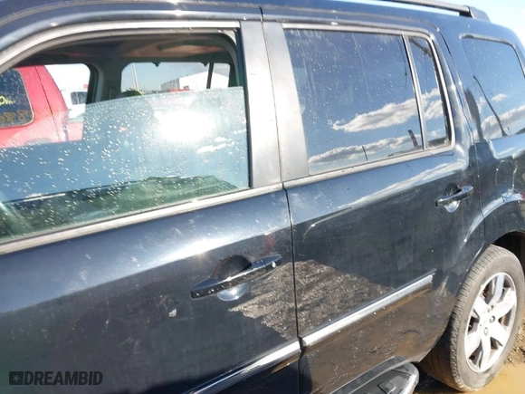 2015 Honda Pilot Touring with VIN 5FNYF4H94FB024890, listed as a IAAI auction lot 41658804 with 118,107 mi miles. Bid and sale history available at carsss.com. Image 15.