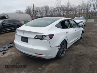 2020 Tesla Model 3 Standard Range Plus with VIN 5YJ3E1EA7LF659172, listed as a IAAI auction lot 42017026 with 32,104 mi miles. Bid and sale history available at carsss.com. Image 6.
