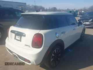 2021 MINI Hardtop 4 Door Cooper S with VIN WMWXU9C00M2P04693, listed as a IAAI auction lot 41785185 with 57,848 mi miles and . Bid and sale history available at DreamBid. Image 4.