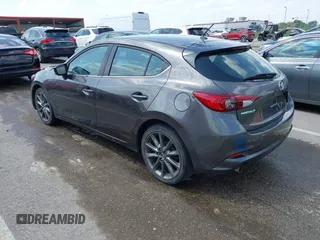 2018 Mazda 3 Touring z VIN 3MZBN1L35JM271525, wystawiony jako IAAI lot #42112552 z przebiegiem 107 299 mil mil oraz . Historia ofert i sprzedaży dostępna na DreamBid. Obrazek 3.