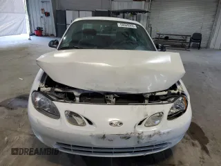 2000 Ford Escort ZX2 z VIN 3FAKP1131YR189603, wystawiony jako Copart lot #58669905 z przebiegiem 72 791 mil mil oraz Czysty tytuł • Clean title. Historia ofert i sprzedaży dostępna na DreamBid. Obrazek 5.