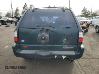 2000 Honda Passport LX с VIN 4S6DM58W0Y4406220, выставлен на аукционе Copart как лот 82774694 с пробегом 171 487 миль миль и Списание • Salvage title. История ставок и продаж доступна на DreamBid. Изображение 6.