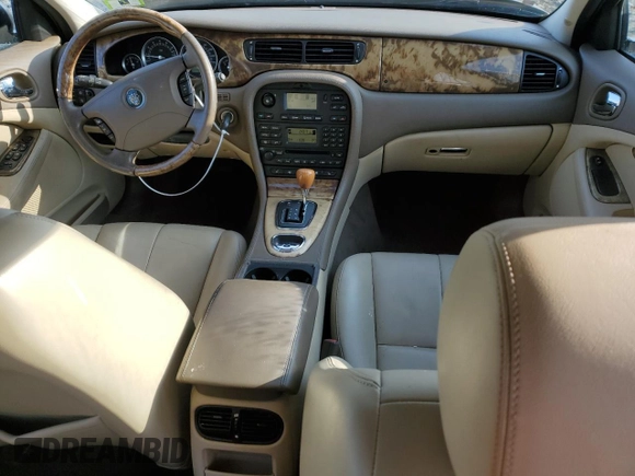 2005 Jaguar S-Type with VIN SAJWA01T55FN14254, listed as a Copart auction lot 86994974 with 126,484 mi miles and Salvage Title. Bid and sale history available at DreamBid. Image 8.