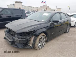 2018 Ford Fusion Hybrid S with VIN 3FA6P0UU9JR100852, listed as a IAAI auction lot 41516157 with 63,458 mi miles. Bid and sale history available at carsss.com. Image 2.