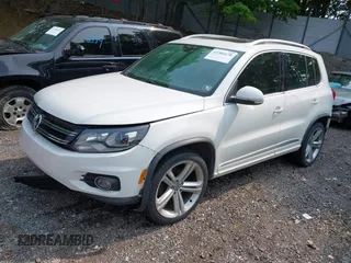 2014 Volkswagen Tiguan SEL with VIN WVGAV3AX7EW022239, listed as a IAAI auction lot 42381670 with 180,729 mi miles and . Bid and sale history available at DreamBid. Image 2.