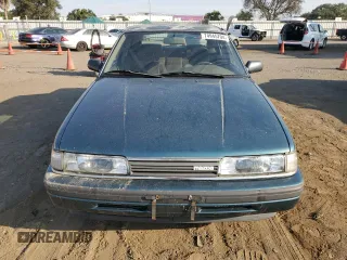 1992 Mazda 626 z VIN 1YVGD22B5N5212605, wystawiony jako Copart lot #74945704 z przebiegiem 99 659 mil mil oraz Tytuł czysty. Historia ofert i sprzedaży dostępna na DreamBid. Obrazek 5.