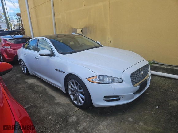 2013 Jaguar XJ with VIN SAJWJ1CD7D8V49599, listed as a Copart auction lot 82354574 with NaN miles and Clean Title. Bid and sale history available at carsss.com. Image 1.