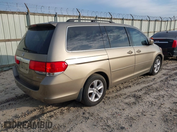 2010 Honda Odyssey Touring with VIN 5FNRL3H9XAB094779, listed as a IAAI auction lot 40412812 with 145,533 mi miles. Bid and sale history available at carsss.com. Image 4.