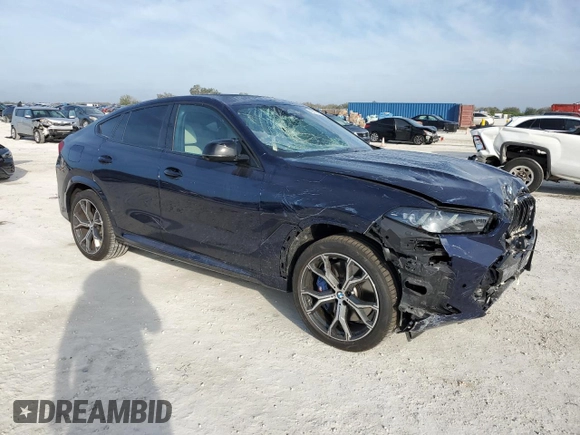 2025 BMW X6 M60i with VIN 5UX43EX01S9X19069, listed as a Copart auction lot 42613105 with 6,909 mi miles and Salvage Title. Bid and sale history available at carsss.com. Image 4.