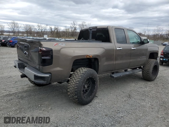 2014 Chevrolet Silverado 1500 LTZ with VIN 1GCVKSEC0EZ140325, listed as a Copart auction lot 52954845 with 128,231 mi miles and Salvage Title. Bid and sale history available at DreamBid. Image 3.