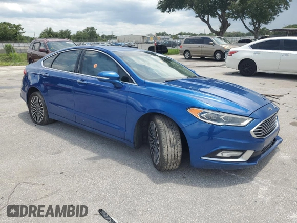 2018 Ford Fusion Titanium with VIN 3FA6P0D97JR219690, listed as a Copart auction lot 63773595 with 138,066 mi miles and Salvage title. Bid and sale history available at DreamBid. Image 4.