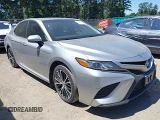 2018 Toyota Camry LE z VIN JTNB11HK3J3038433, wystawiony jako IAAI lot #42450854 z przebiegiem 158 564 mil mil oraz . Historia ofert i sprzedaży dostępna na DreamBid. Obrazek 1.