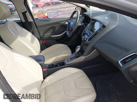 2018 Ford Focus Titanium z VIN 1FADP3J25JL293835, wystawiony jako IAAI lot #41877487 z przebiegiem 109 211 mil mil oraz . Historia ofert i sprzedaży dostępna na DreamBid. Obrazek 5.