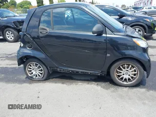 2012 Smart fortwo Pure z VIN WMEEJ3BA1CK556029, wystawiony jako IAAI lot #42173735 z przebiegiem 85 133 mil mil oraz . Historia ofert i sprzedaży dostępna na DreamBid. Obrazek 13.