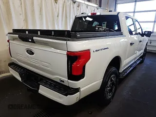 2023 Ford F-150 Lightning Pro with VIN 1FT6W1EVXPWG31056, listed as a IAAI auction lot 42090651 with 342 mi miles. Bid and sale history available at carsss.com. Image 1.