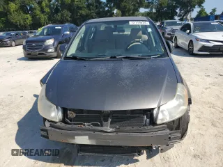 2011 Suzuki SX4 LE with VIN JS2YC5A27B6304410, listed as a Copart auction lot 72119824 with 118,357 mi miles and Salvage Title. Bid and sale history available at carsss.com. Image 5.